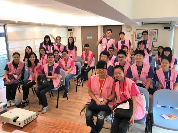 Taking a group photo with smiles after service