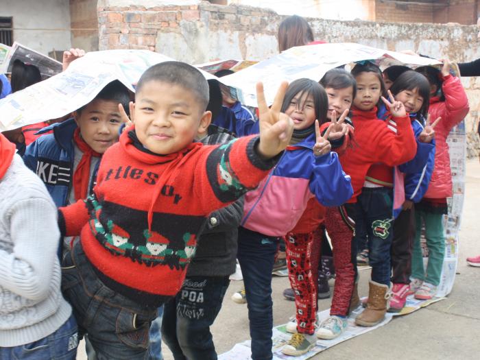 Children playing paper tank joyfully!