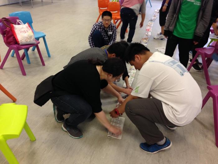 Building their paper tanks in the competition