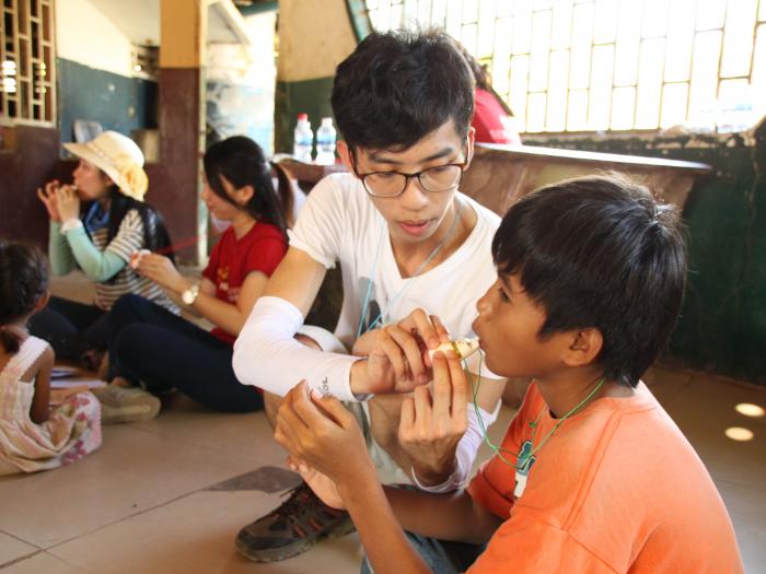 Teaching ocarina to the children in Wat Opat