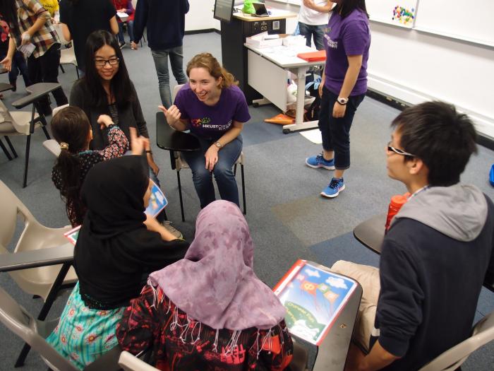 Volunteer chatting with children during the break