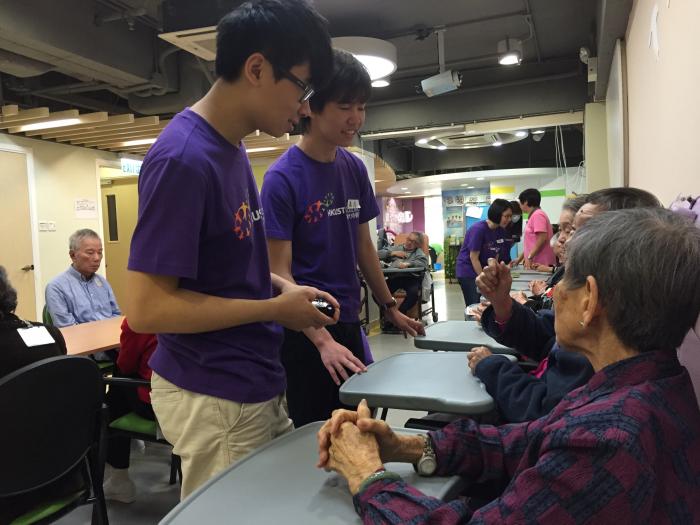 Volunteers interacting with the elderly on one-on-one basis