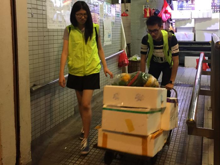 Volunteers transporting the unsold food to the needy elderly
