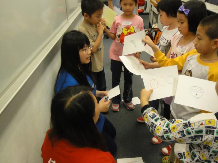 Children sharing their favorite food with our volunteers