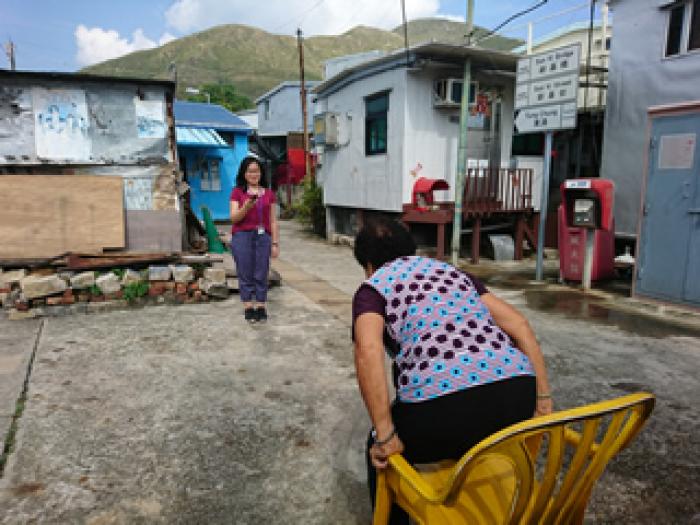 Volunteer conducting health assessment of the elderly