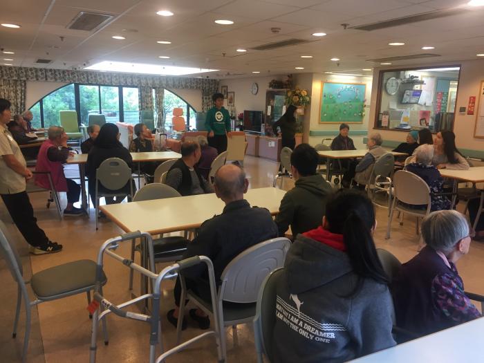 Volunteers playing games with elderly