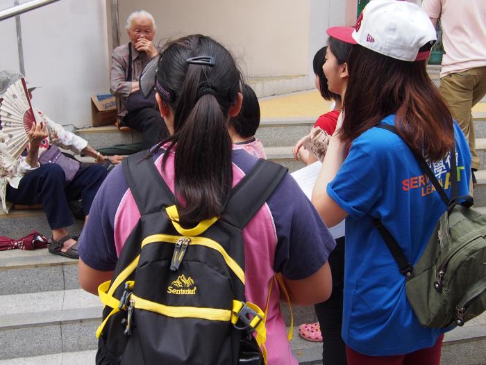 Our volunteers and children talking with elderly to know more about their life