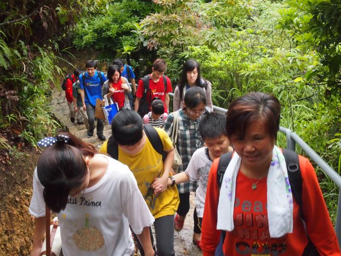 Volunteers and service recipients  climbing hills together