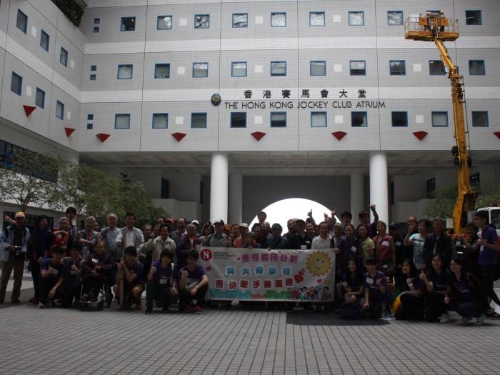 A group of photo of service recipients and volunteers in the Atrium