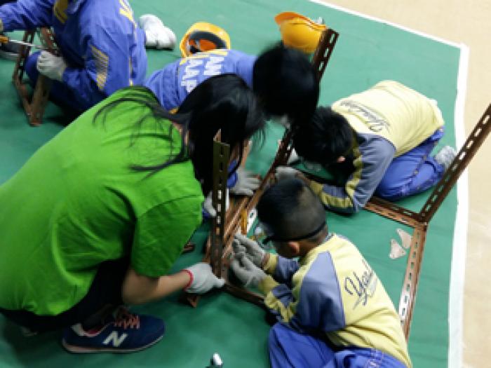 Children enjoying the game with volunteers