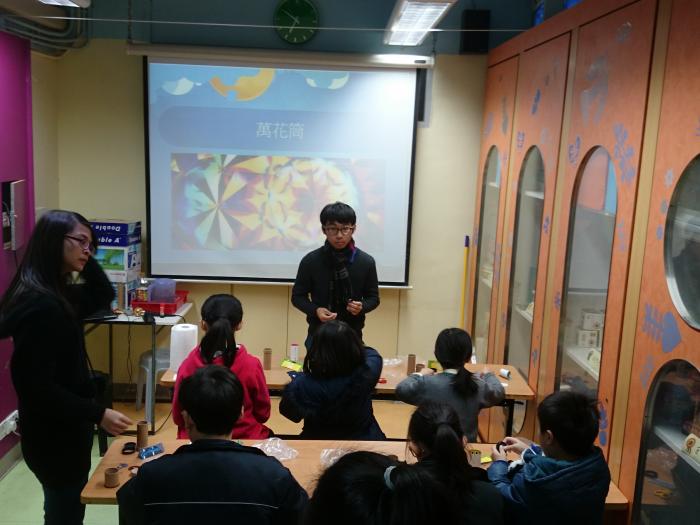 Children doing kaleidoscope to learn more about the properties of light