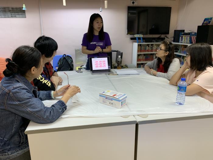 Volunteers teaching parents how to cook healthier
