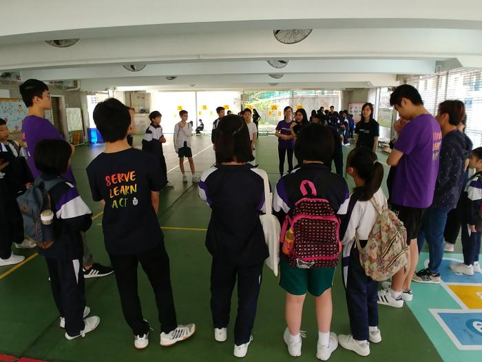 Playing an interactive game with students.