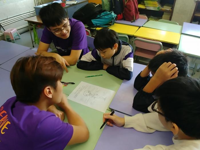 Volunteers teaching science.