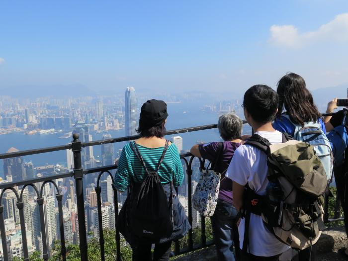 Students and the elderly enjoying the beautiful scenery  of the Victoria Harbour.