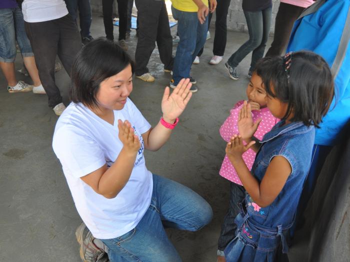 Volunteers interacting with local children