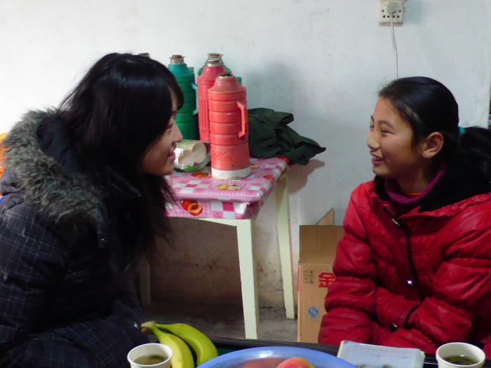 Volunteers visiting a local student's family to learn more about their lives