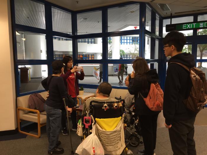 Volunteers and physically challenged adults trying out the VR camera.