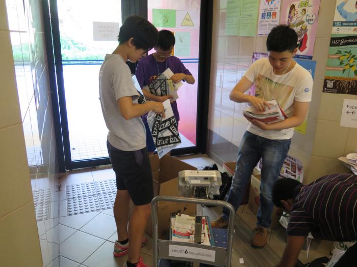 Students sorted surplus materials in a student hall.