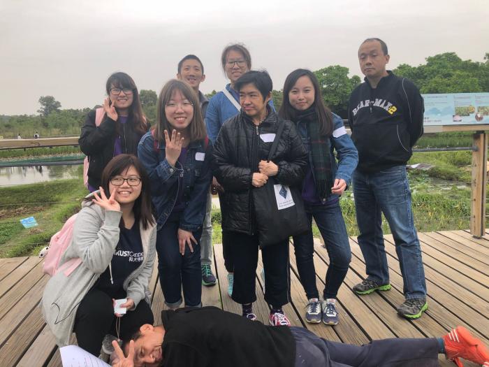 Volunteers take a photo with mentally challenged people.