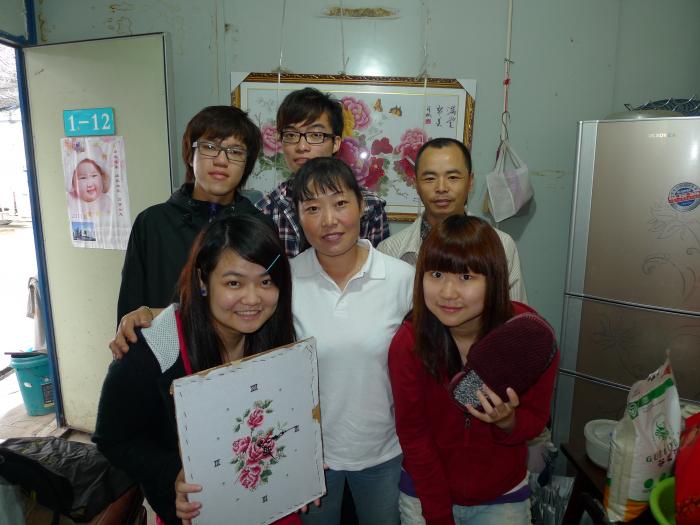 Student volunteers doing the local family visits and exchanging souvenirs.