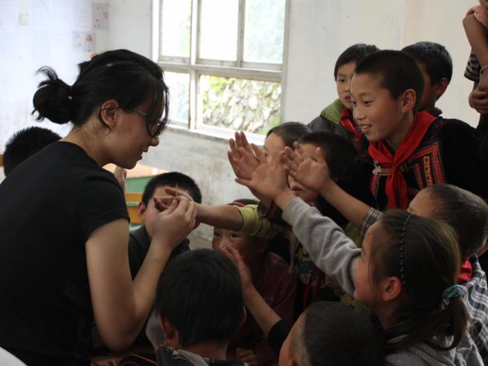 Kids are eager to try out a science experiment.