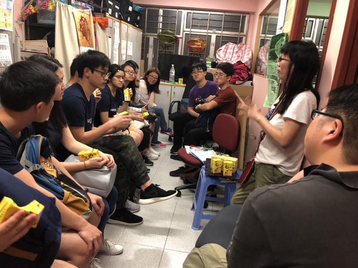 Volunteers are discussing how to connect with the socially withdrawn and the elderly.