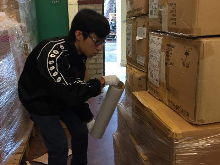 Volunteers packing the checked donated electrical appliances.