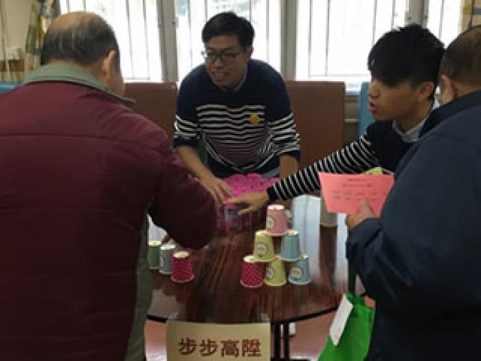 Our student volunteer giving game instructions to the elders	