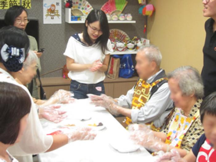 Elders making rice balls together with their family