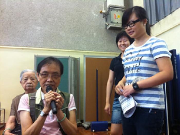 The elder actively participating in the activity	