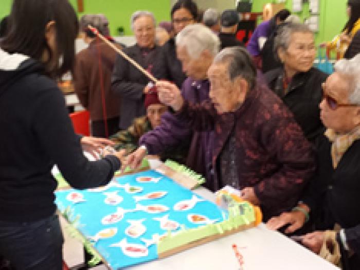 The elderlies enjoying games provided by volunteers