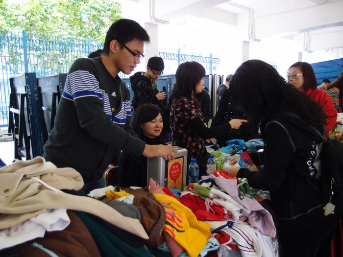 Our volunteers helping to sell second hand clothes