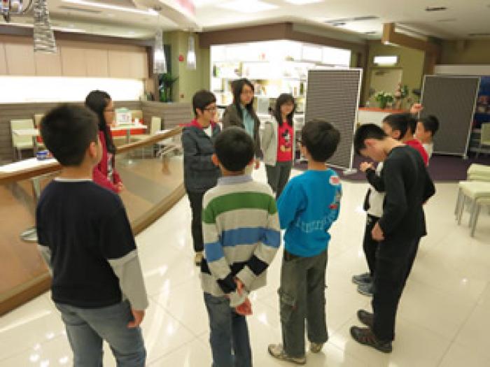 Volunteers introducing game rules to the children