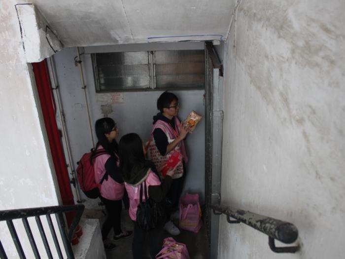 Volunteers wishing good luck for the elder with  traditional greetings