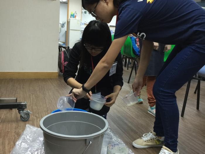 Volunteers preparing painting tools