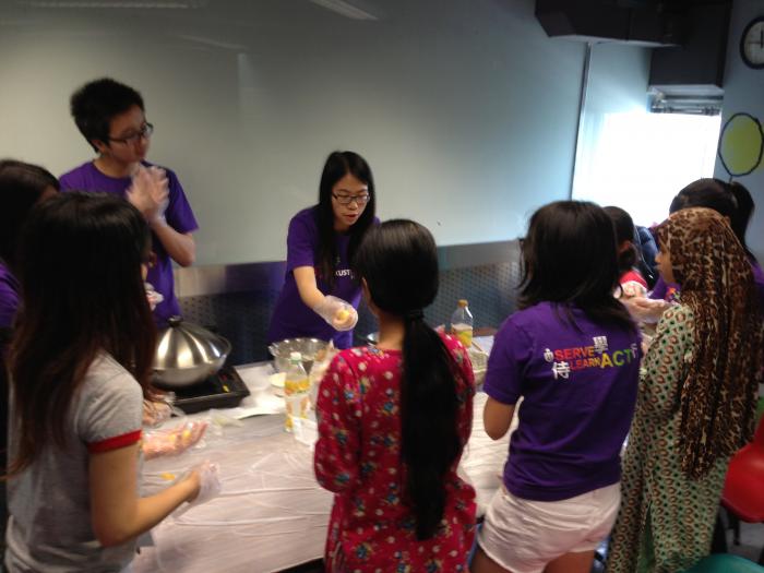 Volunteers distributing materials to particpants