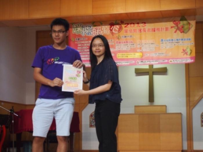 Our student representative receiving a certificate of appreciation from the organizer