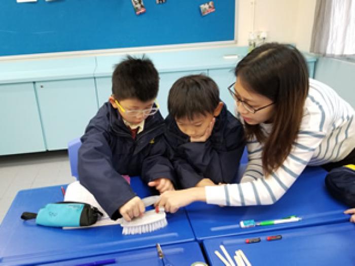 Volunteers teaching STEM workshops in the classrooms