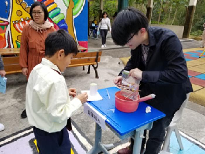 Students enjoying a Science Fun Fair in the playground 