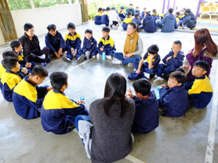 Sitting in a circle to say hello to one another