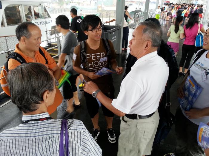 Volunteer promoting sea safety to the residents