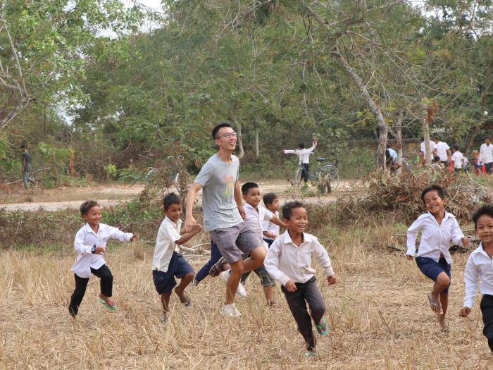 Volunteers running around with students after class