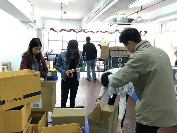 Volunteers made boxes out from cardboards in teams