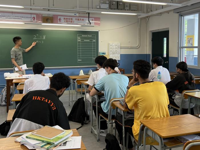 Volunteers introducing logarithms to students