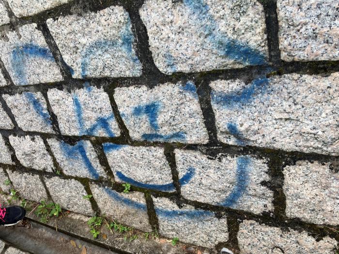 A 'before' picture of a graffiti on rocks