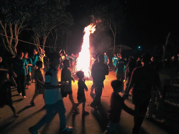 Having campfire with the local youth