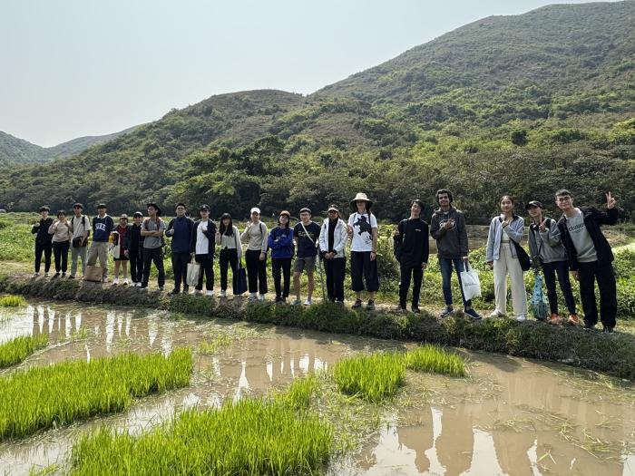 Celebrating the joy of nature and friendship after a hard day's work planting rice!