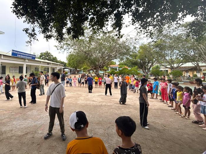 Volunteers having game with local children