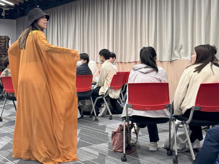 The host dressing up and acting as different characters to create an immersive experience for participants